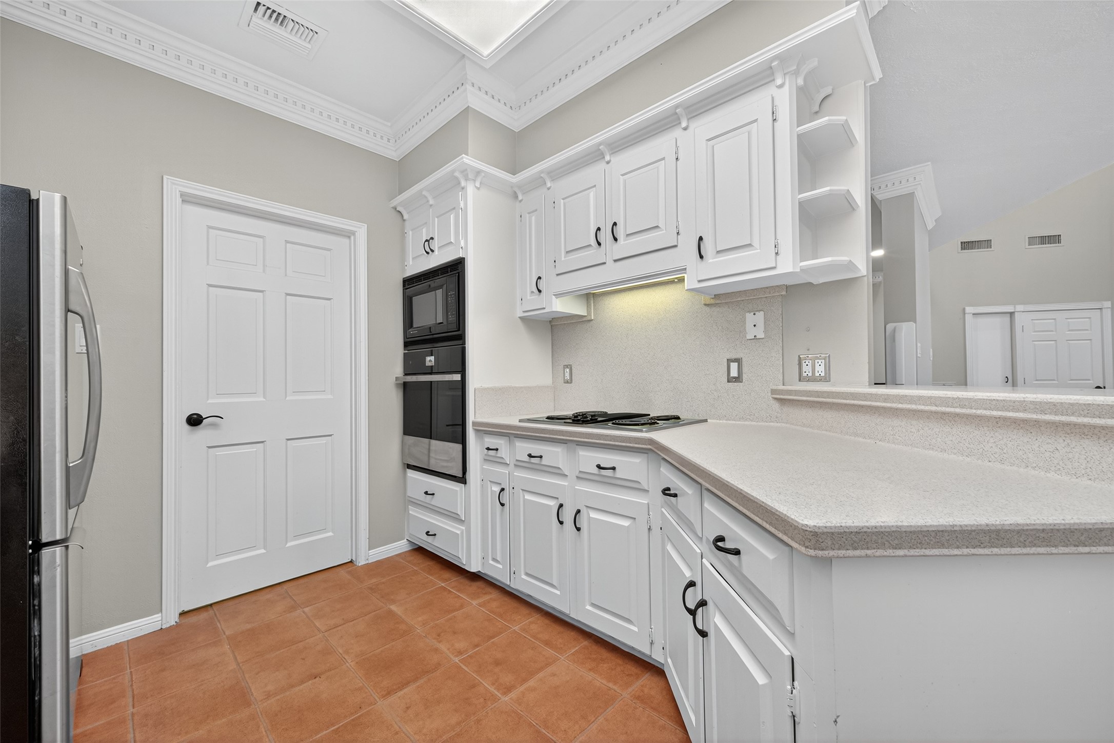 901 Longmire Road, Unit 13 Conroe, TX 77304 - Photo 22 of 46 a kitchen with stainless steel appliances granite countertop a stove and a refrigerator