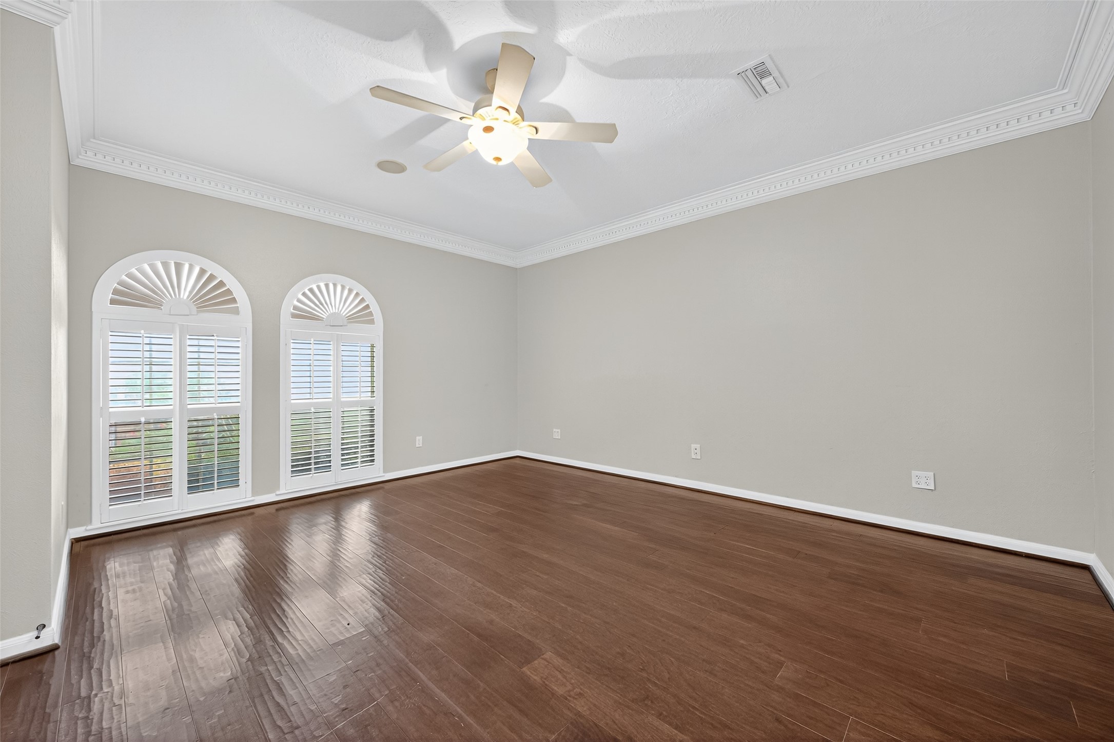 901 Longmire Road, Unit 13 Conroe, TX 77304 - Photo 29 of 46 a view of an empty room with wooden floor and a window