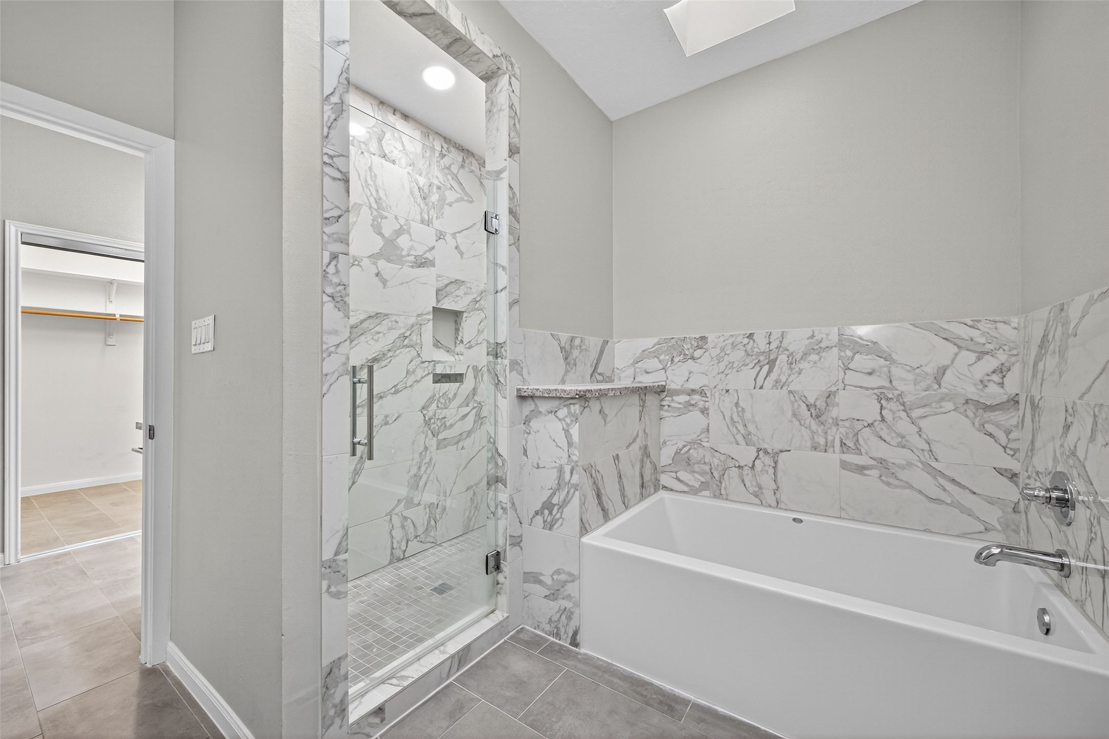 901 Longmire Road, Unit 13 Conroe, TX 77304 - Photo 34 of 46 a bathroom with bathtub shower and toilet