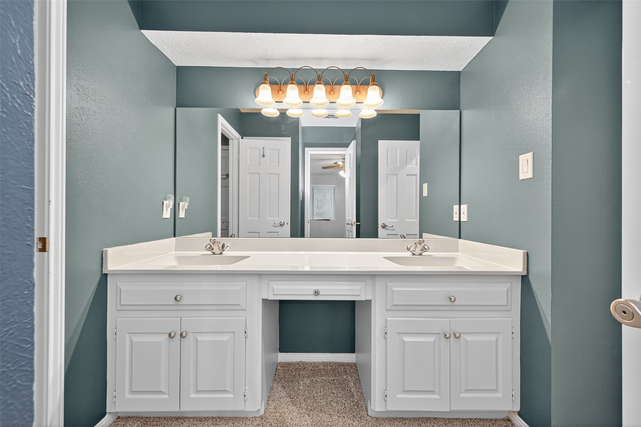 901 Longmire Road, Unit 13 Conroe, TX 77304 - Photo 40 of 46 a view with granite countertop a sink and chandelier