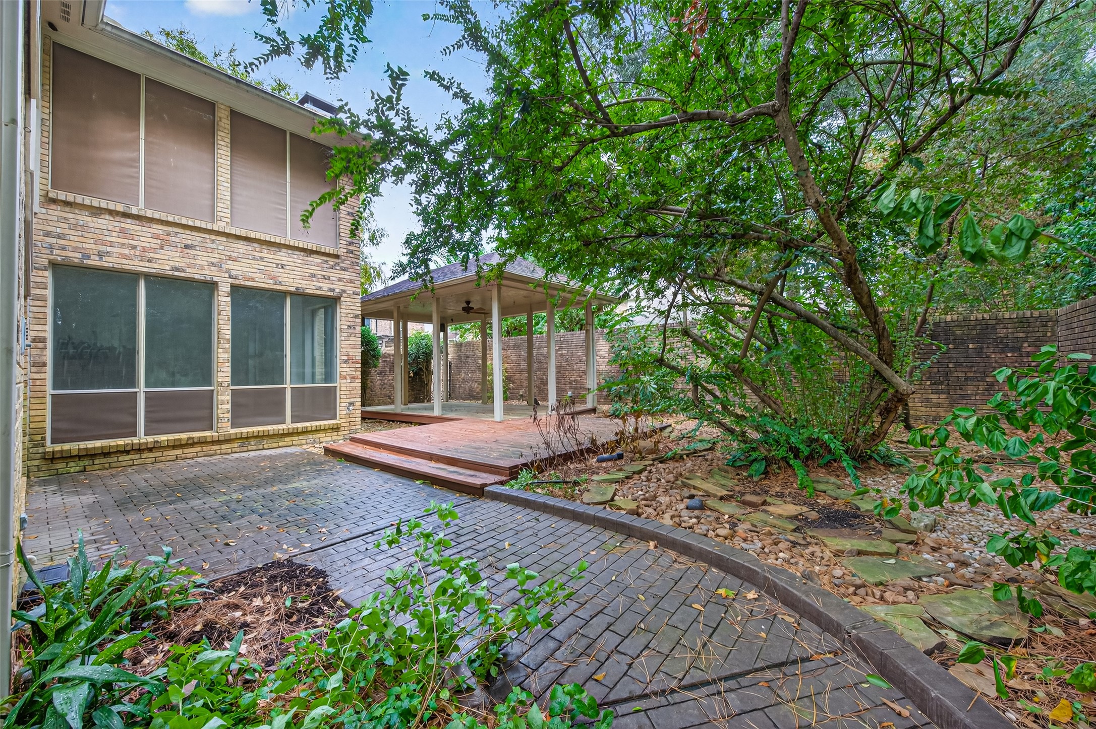 901 Longmire Road, Unit 13 Conroe, TX 77304 - Photo 44 of 46 a house view with a garden space