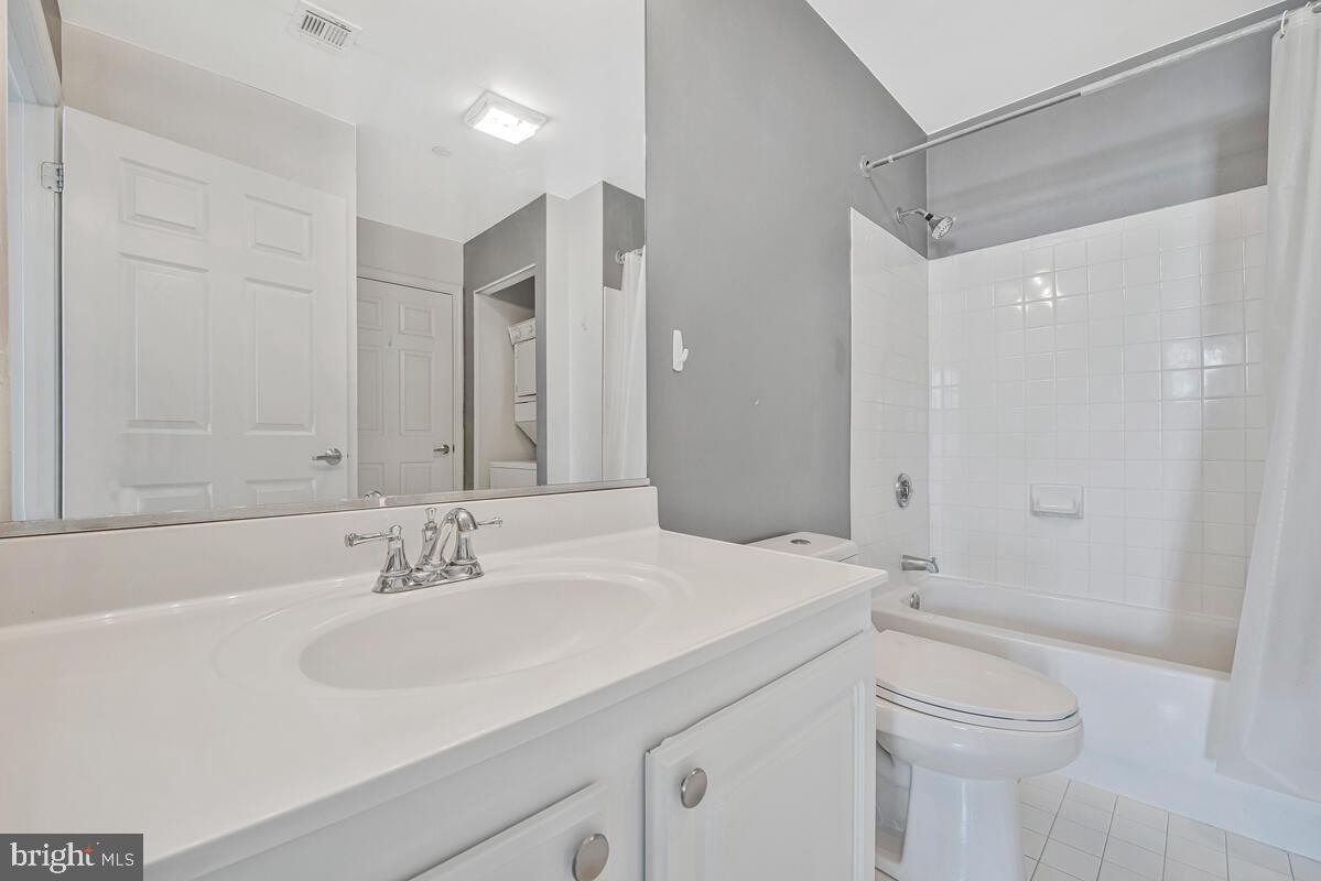 23 Pierside Drive, Unit 129 Baltimore, MD 21230 - Photo 11 of 19 a bathroom with a sink toilet and shower