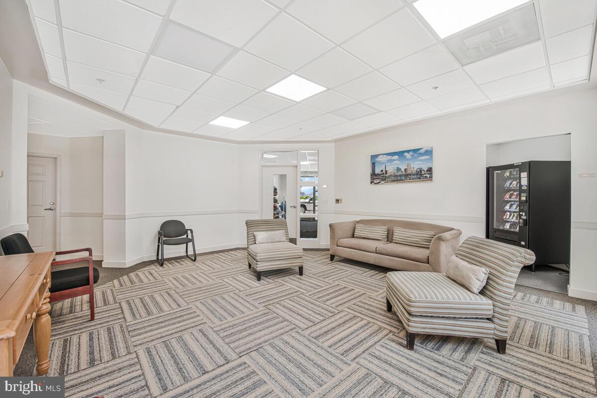 23 Pierside Drive, Unit 129 Baltimore, MD 21230 - Photo 16 of 19 a living room with furniture and a couch