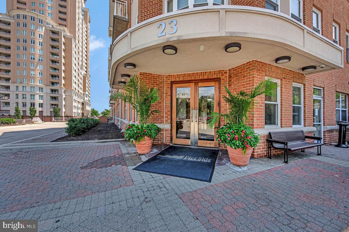 23 Pierside Drive, Unit 129 Baltimore, MD 21230 - Photo 2 of 19 a front view of building with yard