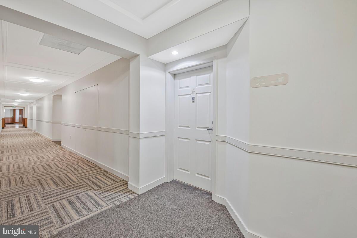 23 Pierside Drive, Unit 129 Baltimore, MD 21230 - Photo 4 of 19 a view of a livingroom with wooden floor