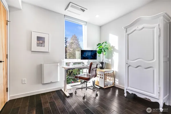 a view of a livingroom with furniture and a potted plant