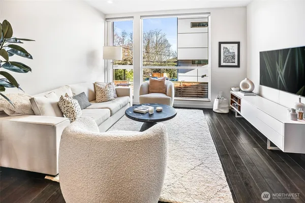 a living room with furniture and a large window