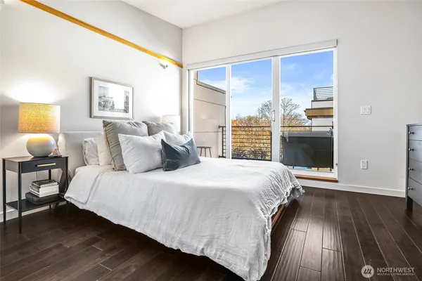 a bedroom with a large bed and a window