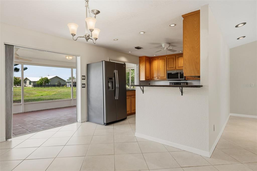 25391 Rupert Road Punta Gorda, FL 33983 - Photo 15 of 38 a view of a kitchen with furniture and a window