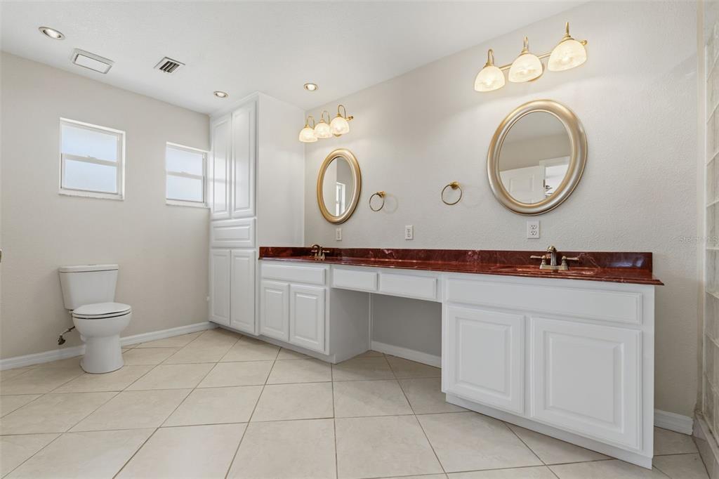 25391 Rupert Road Punta Gorda, FL 33983 - Photo 21 of 38 a bathroom with a toilet a sink and a mirror