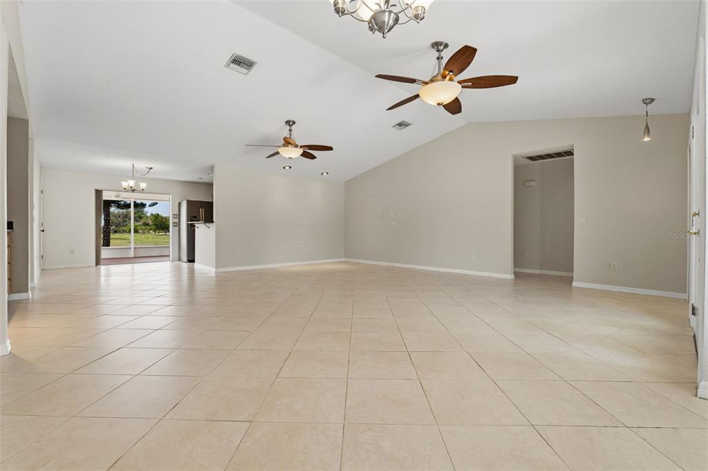 25391 Rupert Road Punta Gorda, FL 33983 - Photo 3 of 38 wooden floor in an empty room with a window