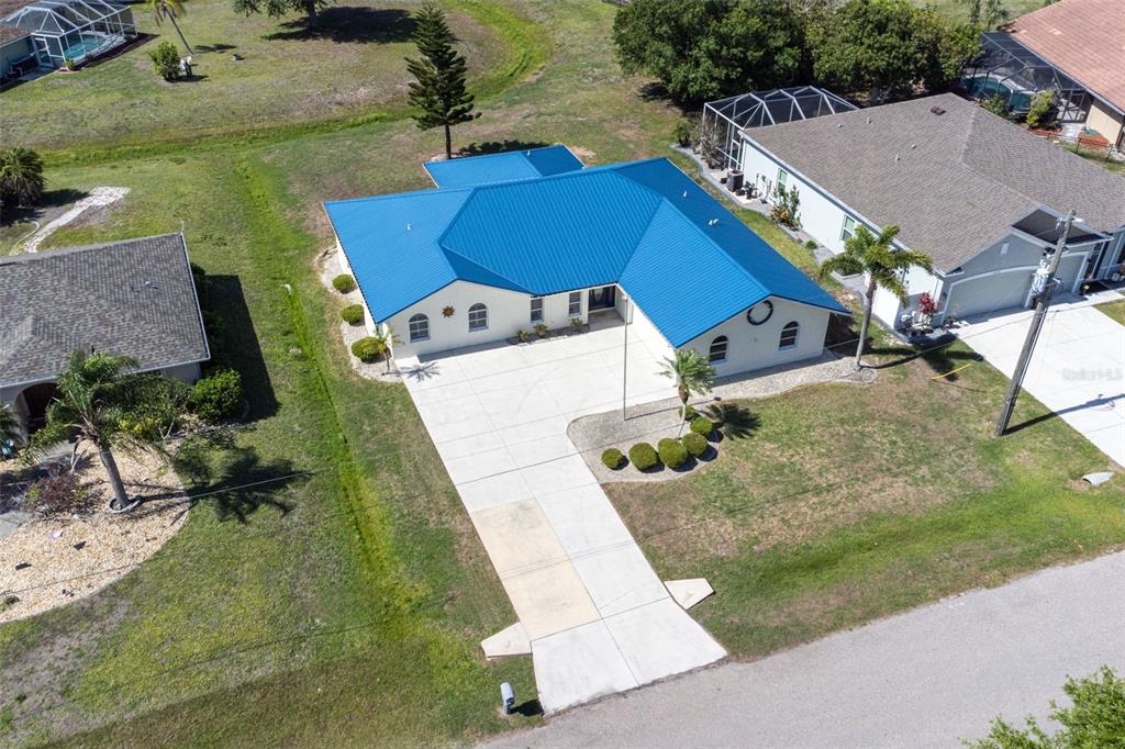 25391 Rupert Road Punta Gorda, FL 33983 - Photo 35 of 38 an aerial view of a house with swimming pool and large trees