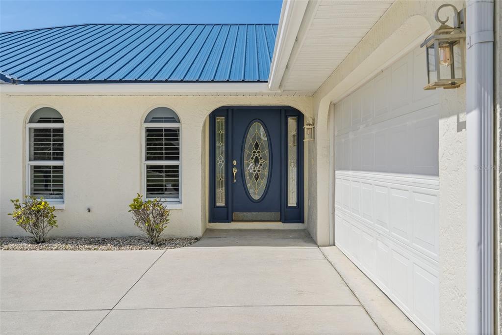 25391 Rupert Road Punta Gorda, FL 33983 - Photo 7 of 38 a front view of a house with garden
