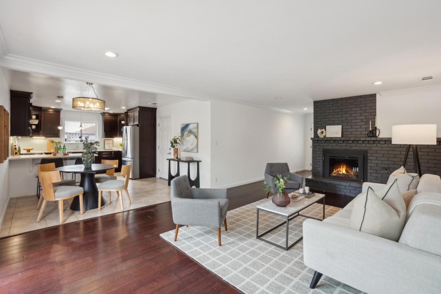 907 3rd Avenue Half Moon Bay, CA 94019 - Photo 11 of 37 a living room with furniture and a fireplace