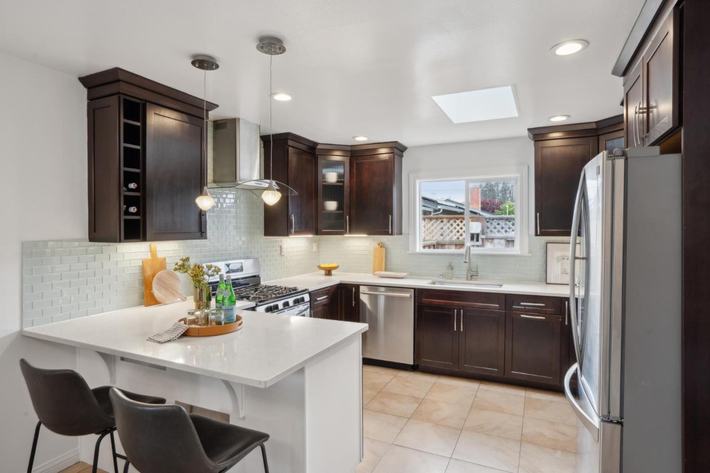 907 3rd Avenue Half Moon Bay, CA 94019 - Photo 13 of 37 a kitchen with a sink cabinets and refrigerator