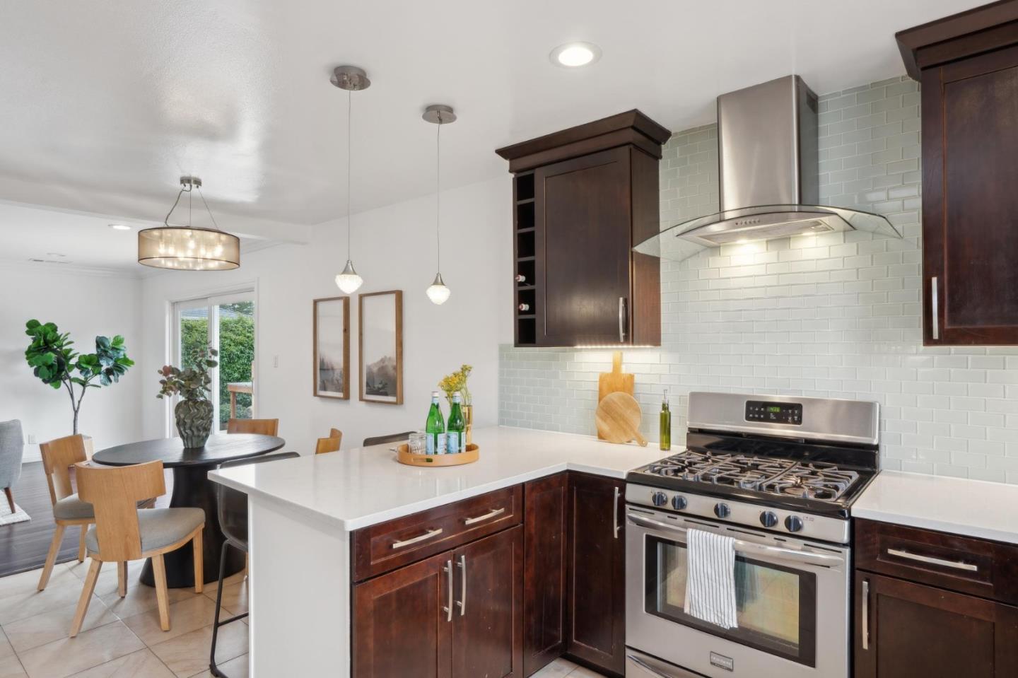 907 3rd Avenue Half Moon Bay, CA 94019 - Photo 16 of 37 a kitchen with stainless steel appliances granite countertop a stove and a refrigerator