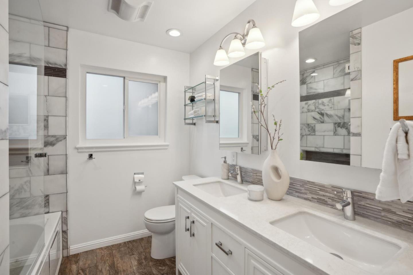 907 3rd Avenue Half Moon Bay, CA 94019 - Photo 22 of 37 a bathroom with a granite countertop sink toilet and shower