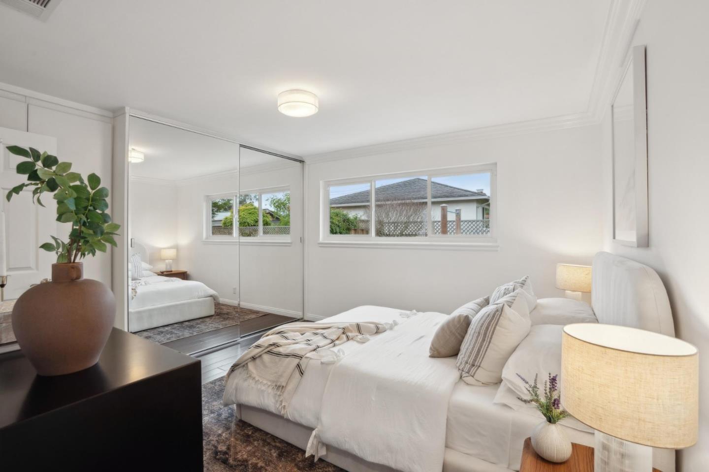 907 3rd Avenue Half Moon Bay, CA 94019 - Photo 24 of 37 a bedroom with a bed and a potted plant