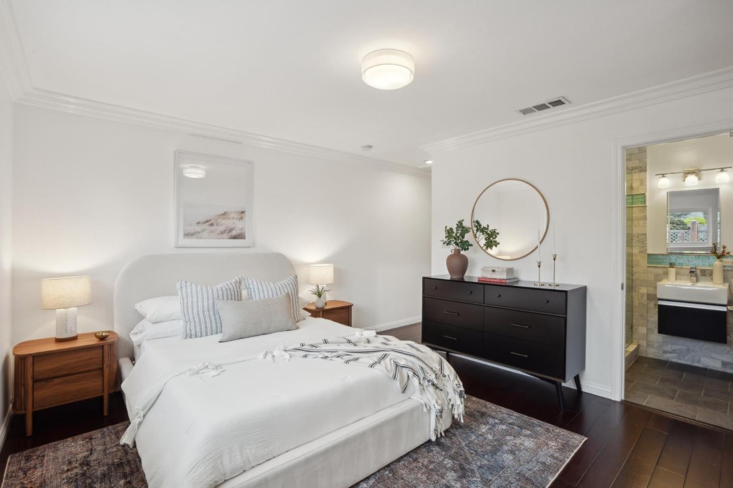 907 3rd Avenue Half Moon Bay, CA 94019 - Photo 25 of 37 a bedroom with a bed and wooden floor