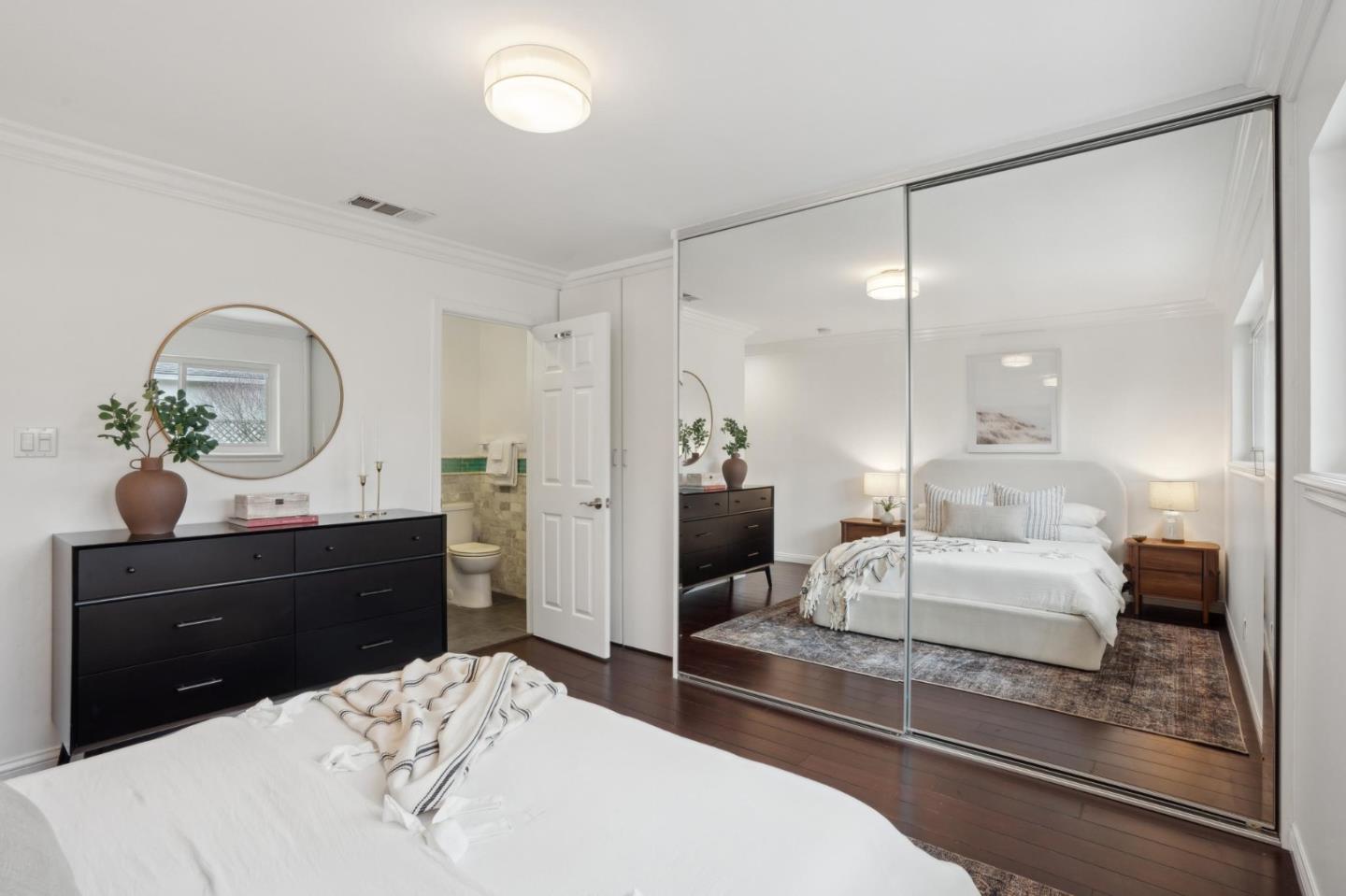 907 3rd Avenue Half Moon Bay, CA 94019 - Photo 26 of 37 a living room with a bed mirror and furniture