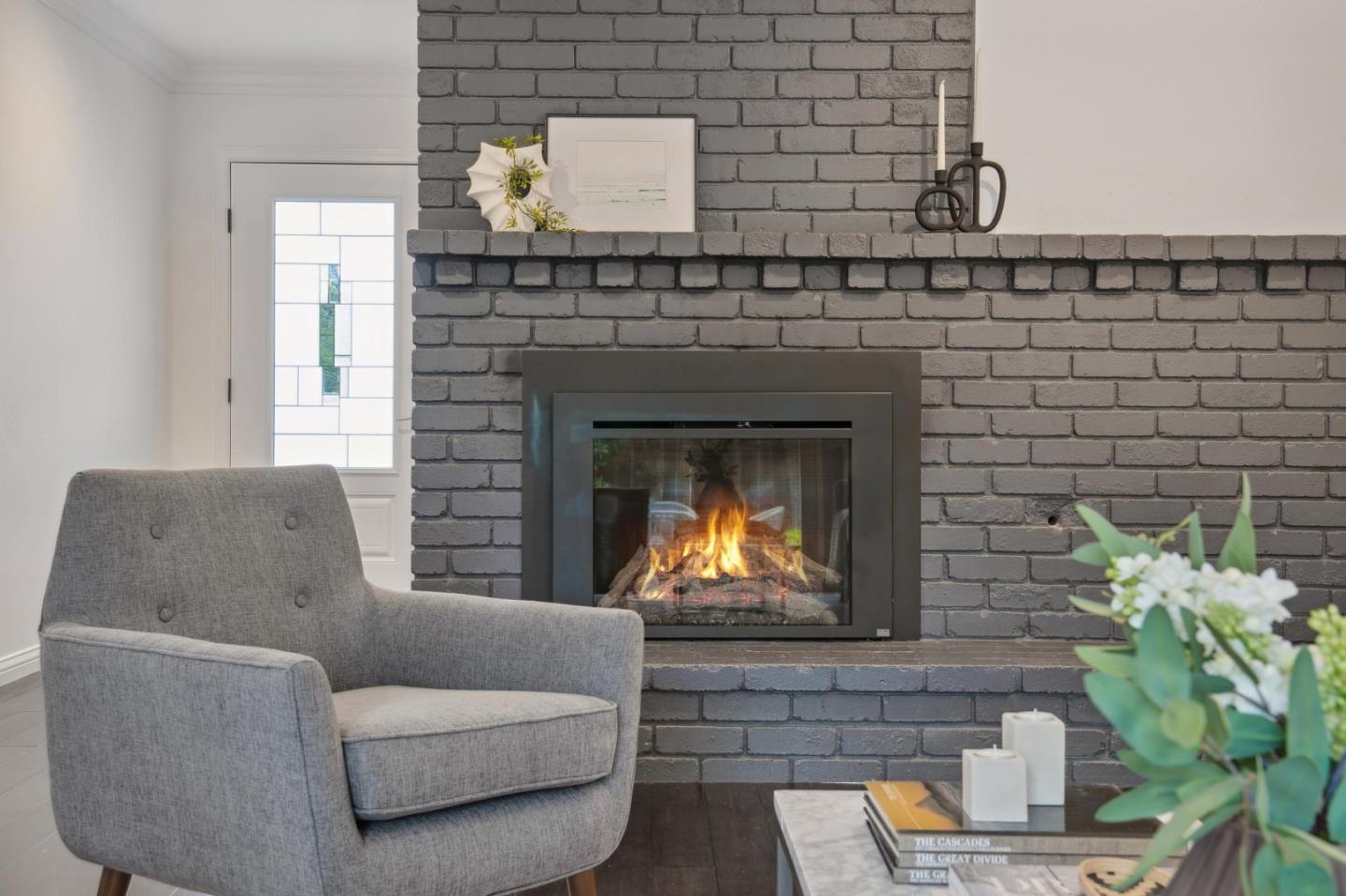 907 3rd Avenue Half Moon Bay, CA 94019 - Photo 9 of 37 a living room with furniture and a fireplace