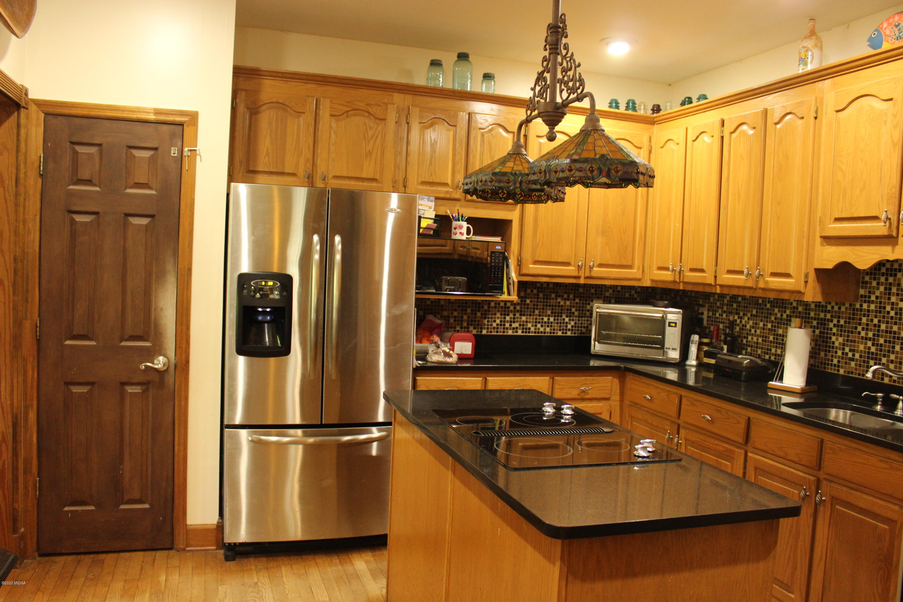 30 Chambless Road Forsyth, GA 31029 - Photo 13 of 27 a kitchen with stainless steel appliances a refrigerator a sink and white cabinets
