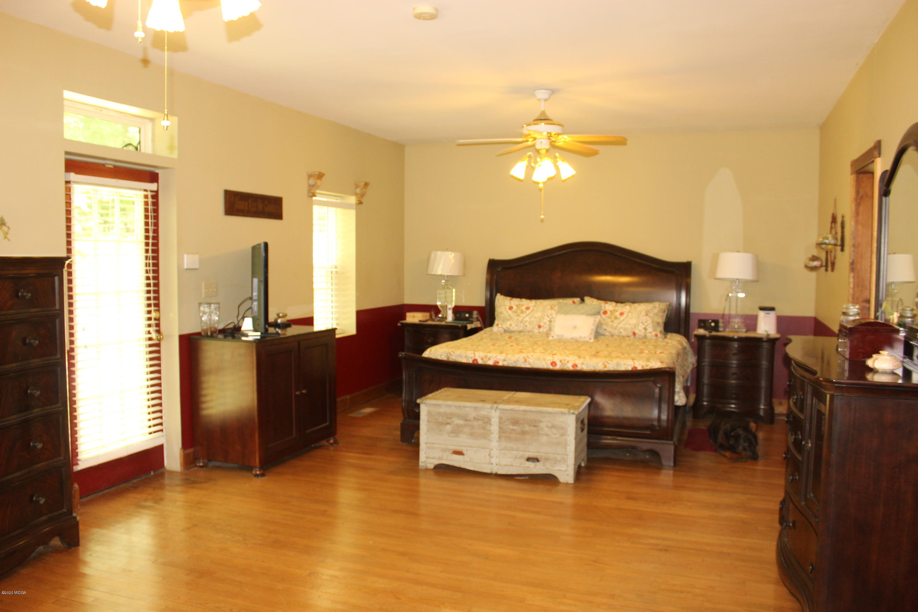 30 Chambless Road Forsyth, GA 31029 - Photo 15 of 27 a living room with furniture and a chandelier