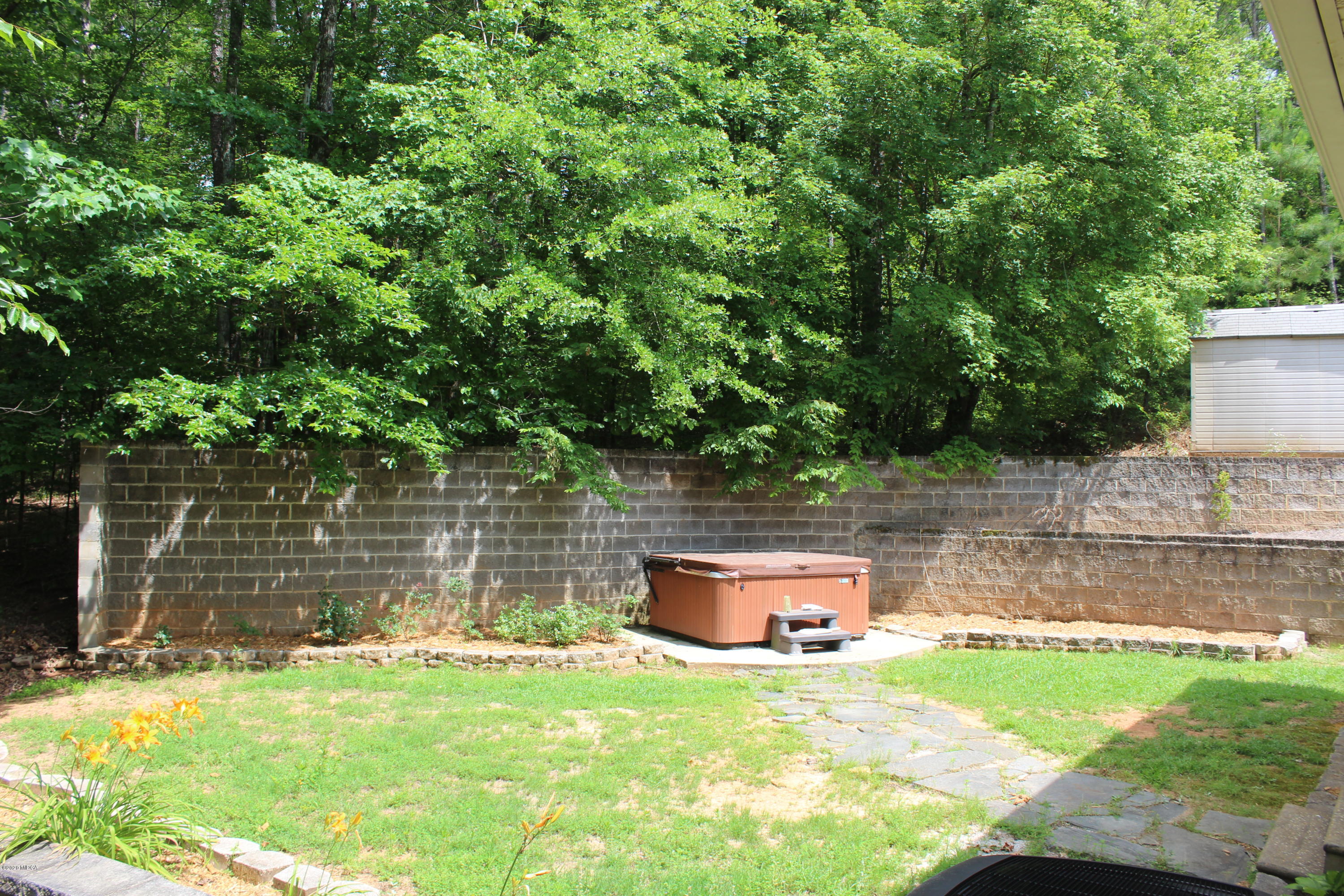 30 Chambless Road Forsyth, GA 31029 - Photo 23 of 27 a backyard of a house with yard and outdoor seating