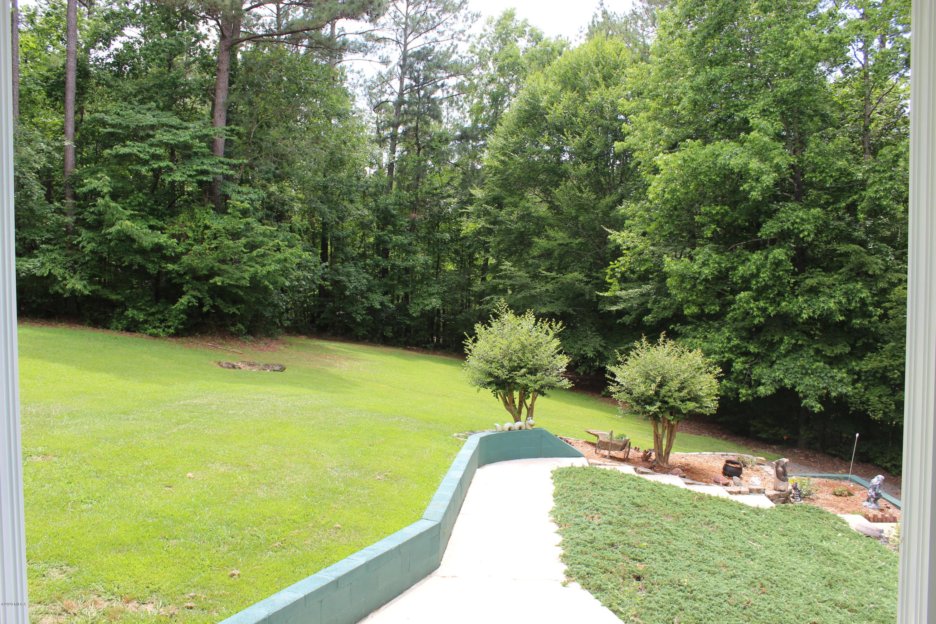 30 Chambless Road Forsyth, GA 31029 - Photo 5 of 27 a view of a swimming pool with a yard
