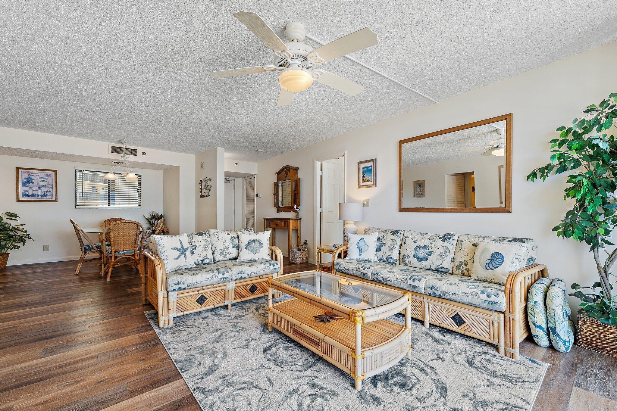 300 Ocean Trail Way, Unit 403 Jupiter, FL 33477 - Photo 14 of 50 a living room with furniture and a table