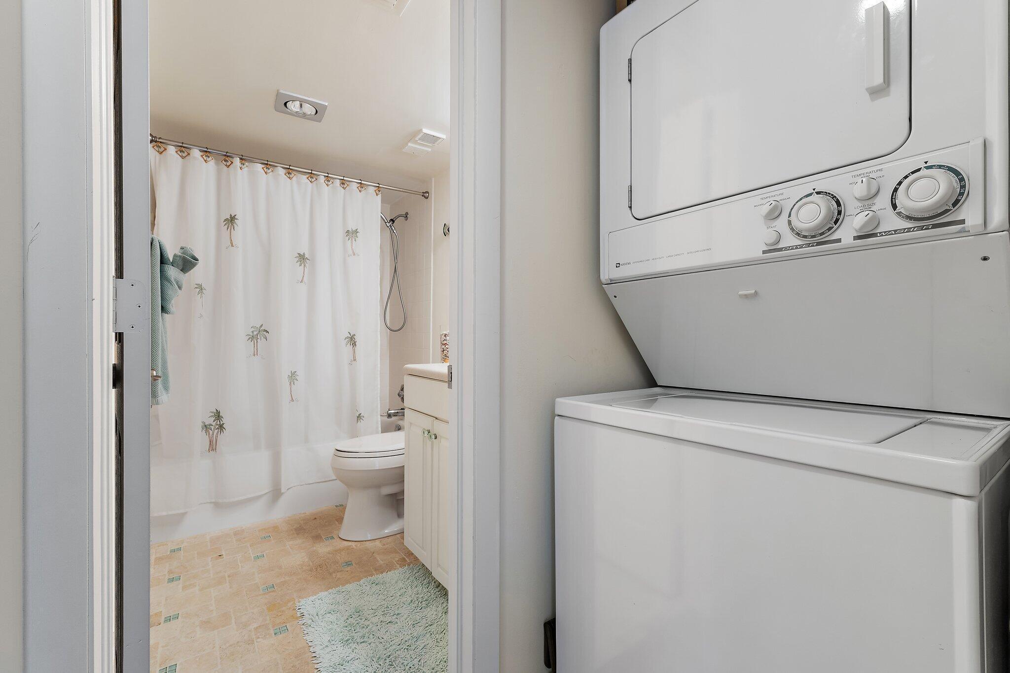 300 Ocean Trail Way, Unit 403 Jupiter, FL 33477 - Photo 26 of 50 a bathroom with a granite countertop sink a toilet and shower