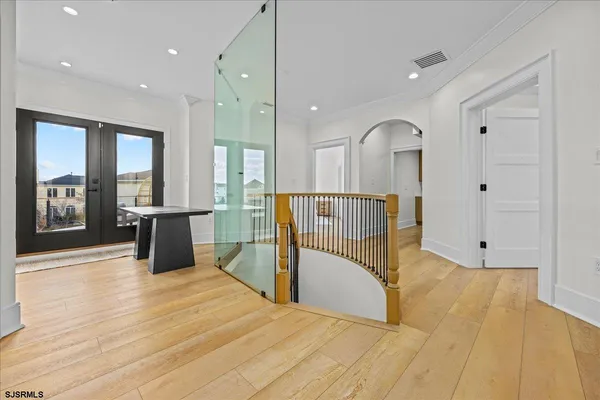 a spacious bedroom with a large bed and a fireplace