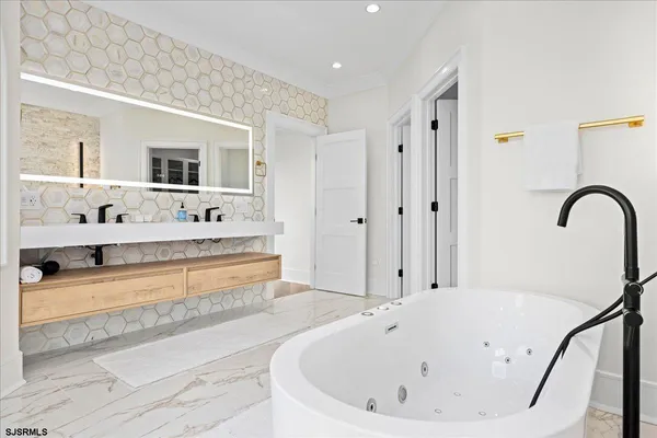 a view of a chairs and table in the balcony