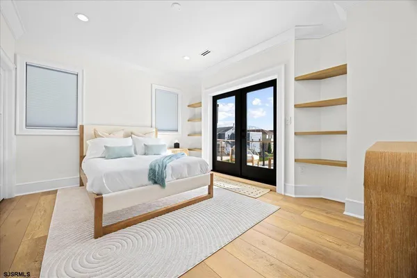 a bedroom with a bed and a night stand