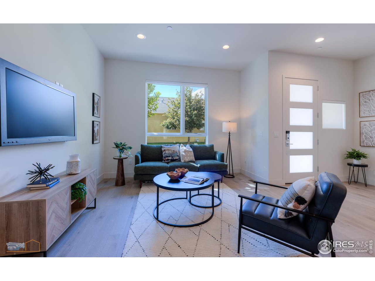 3105 Bluff Street Boulder, CO 80301 - Photo 11 of 40 a living room with furniture and a flat screen tv