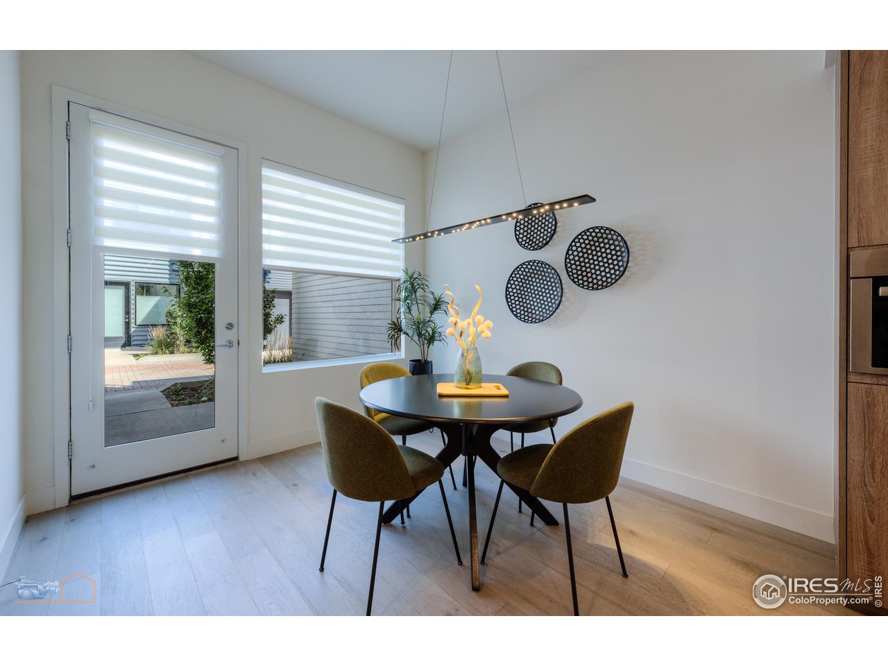 3105 Bluff Street Boulder, CO 80301 - Photo 12 of 40 a view of a dining room with furniture and wooden floor