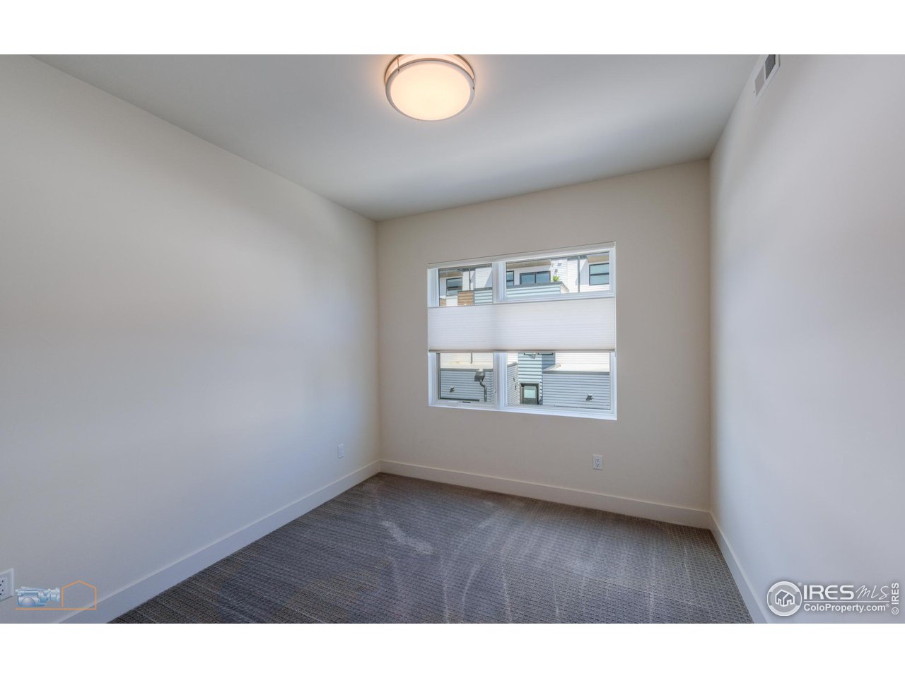 3105 Bluff Street Boulder, CO 80301 - Photo 28 of 40 a view of an empty room with wooden floor and window