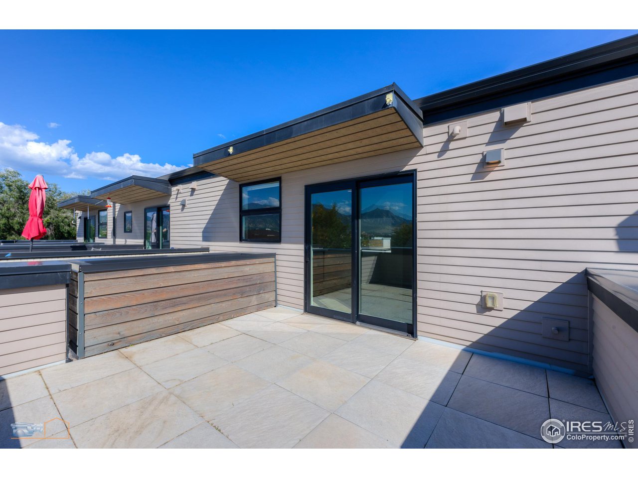 3105 Bluff Street Boulder, CO 80301 - Photo 36 of 40 a view of a patio with table and chairs with wooden floor and fence