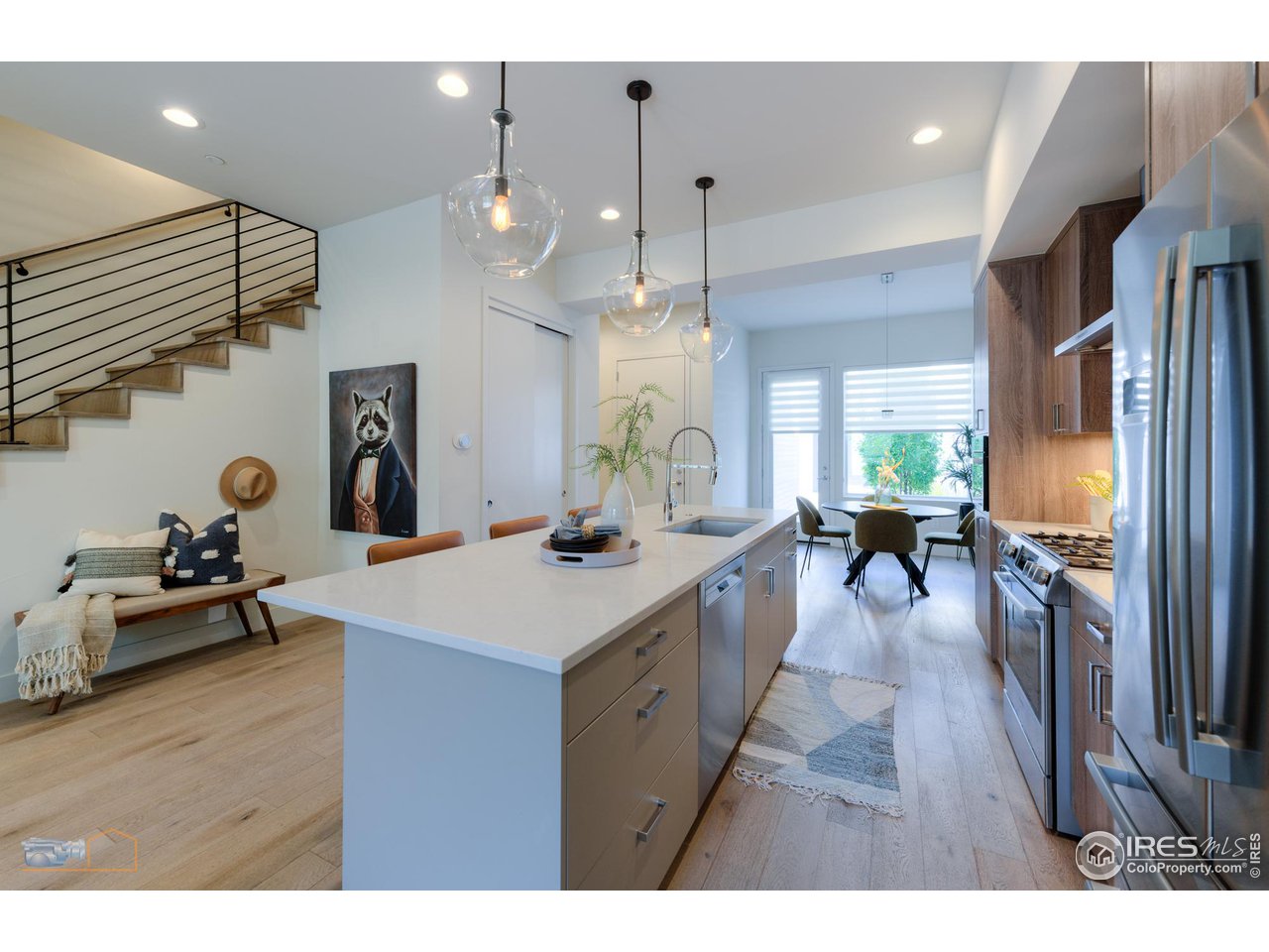 3105 Bluff Street Boulder, CO 80301 - Photo 8 of 40 a large kitchen with cabinets a sink a counter space and stainless steel appliances