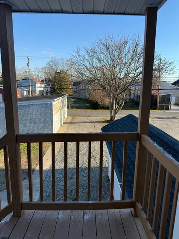 a view of a balcony with a tree