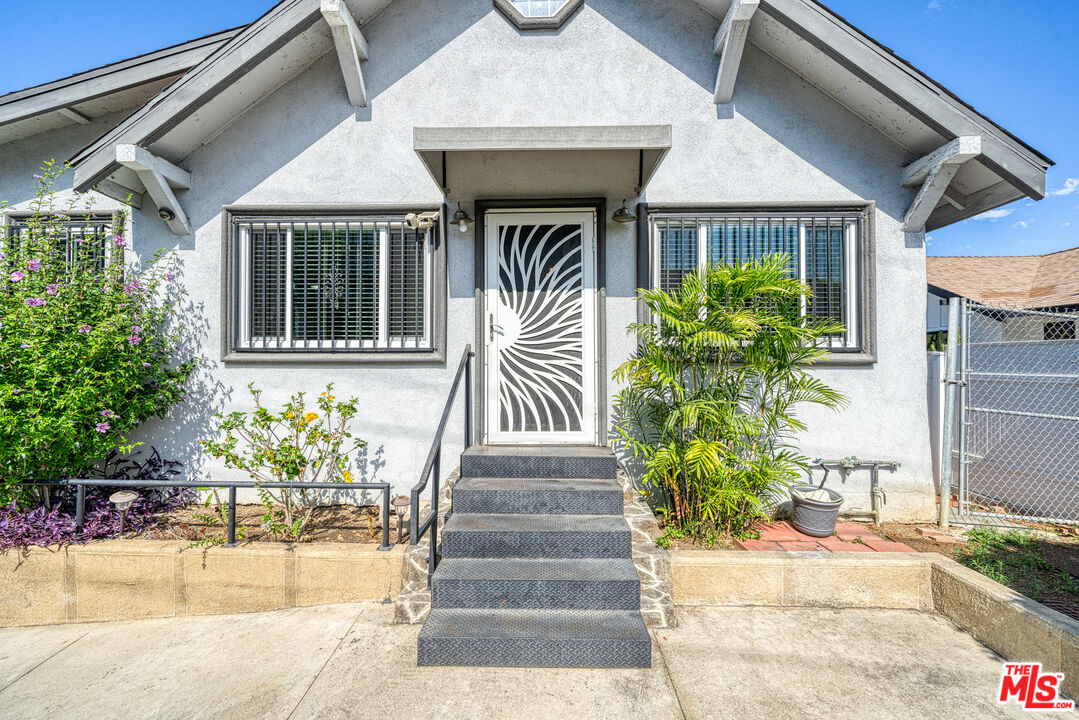 117 South Virgil Avenue Los Angeles, CA 90004 - Photo 1 of 33 a front view of a house with garden