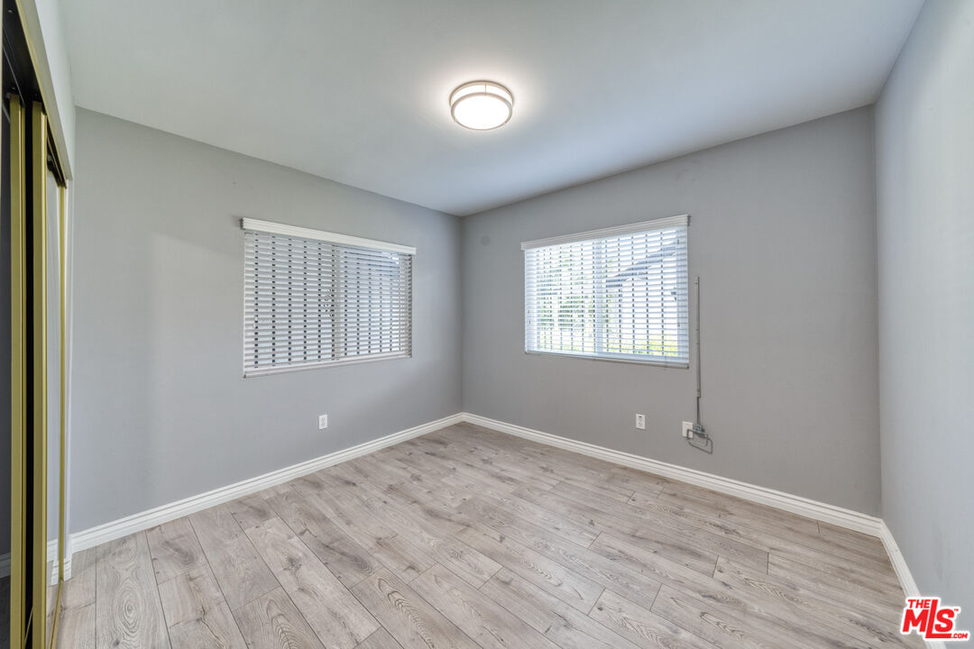 117 South Virgil Avenue Los Angeles, CA 90004 - Photo 11 of 33 an empty room with windows and closet