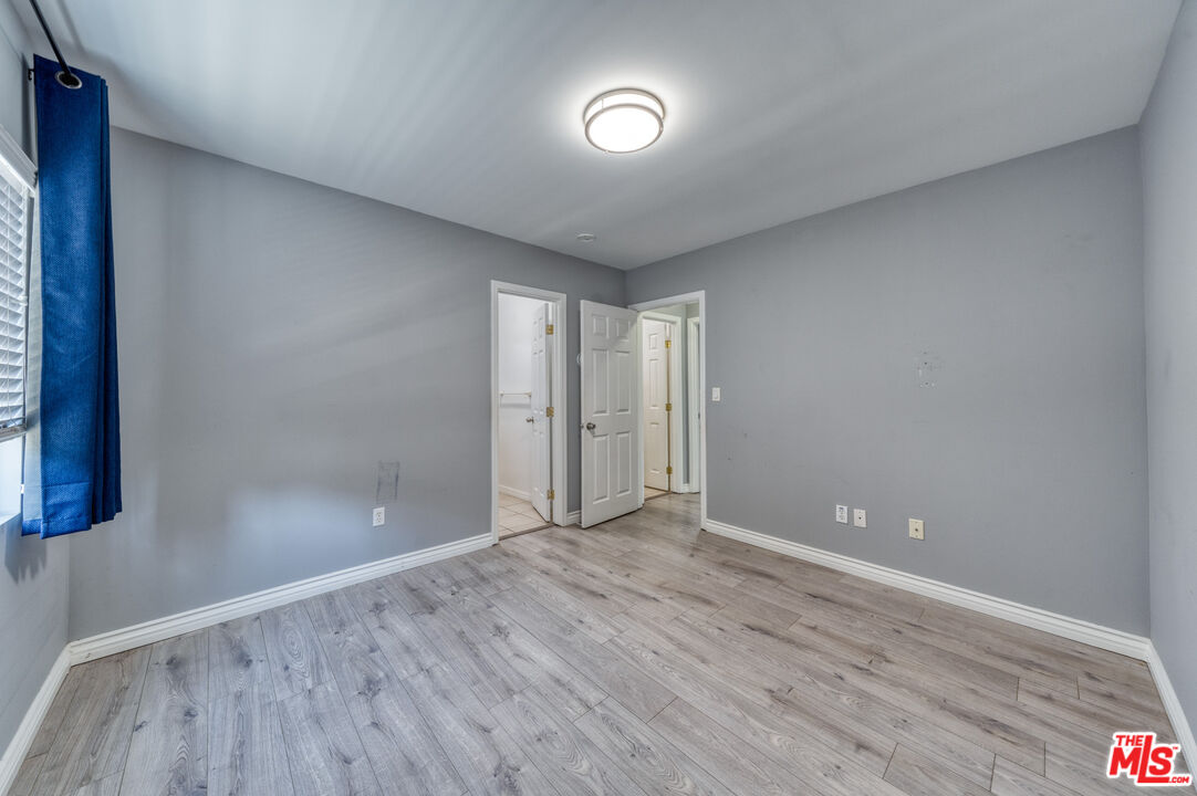 117 South Virgil Avenue Los Angeles, CA 90004 - Photo 12 of 33 a view of an empty room with wooden floor