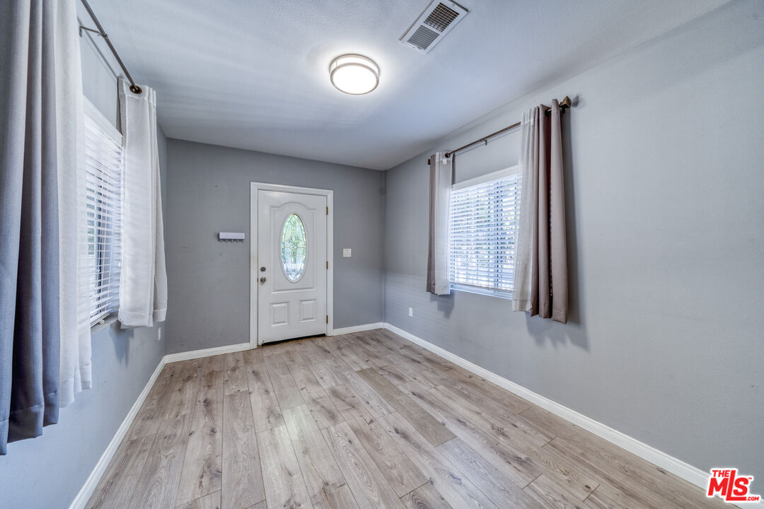 117 South Virgil Avenue Los Angeles, CA 90004 - Photo 13 of 33 a view of empty room with wooden floor and fan