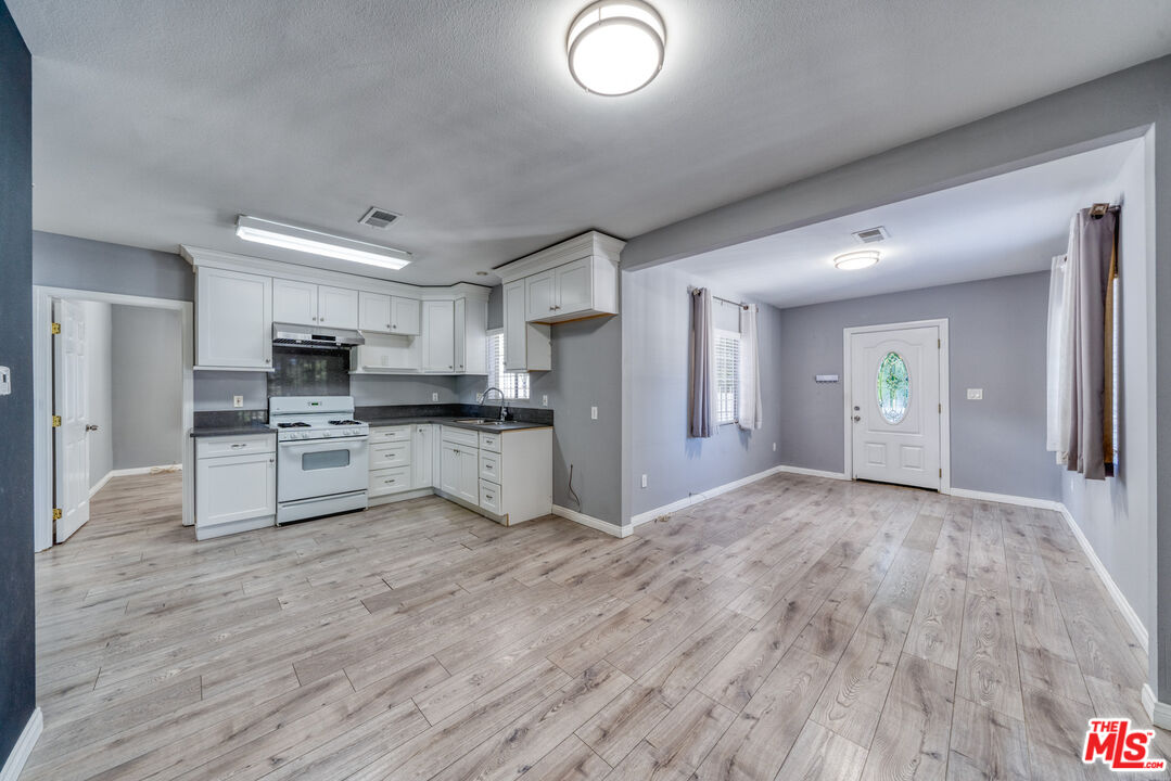 117 South Virgil Avenue Los Angeles, CA 90004 - Photo 15 of 33 a view of kitchen with wooden floor