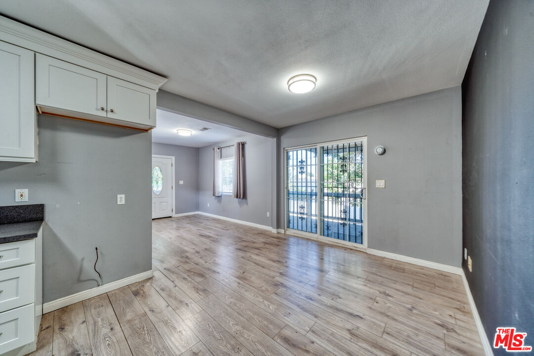 117 South Virgil Avenue Los Angeles, CA 90004 - Photo 17 of 33 a view of an empty room with wooden floor and a window