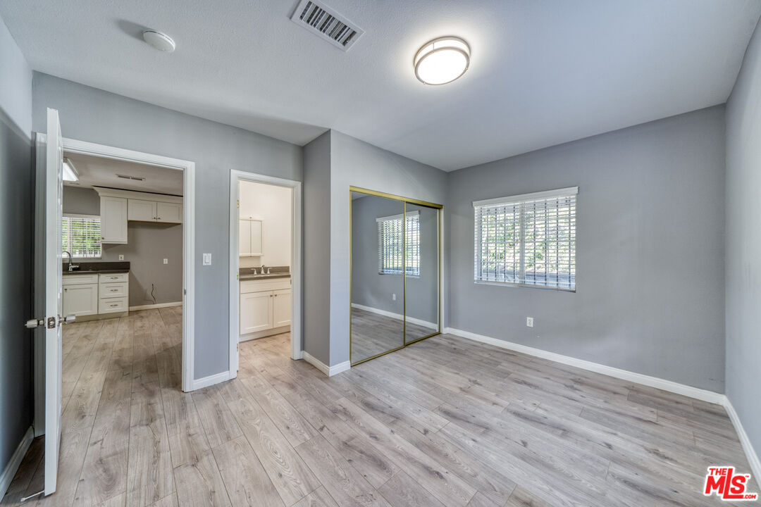 117 South Virgil Avenue Los Angeles, CA 90004 - Photo 19 of 33 wooden floor in an empty room with a window