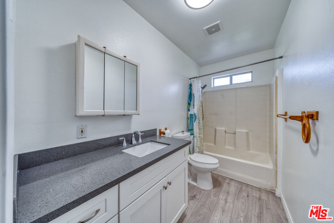117 South Virgil Avenue Los Angeles, CA 90004 - Photo 21 of 33 a bathroom with a sink a toilet and shower