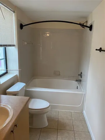 a bathroom with a sink a toilet and a bathtub