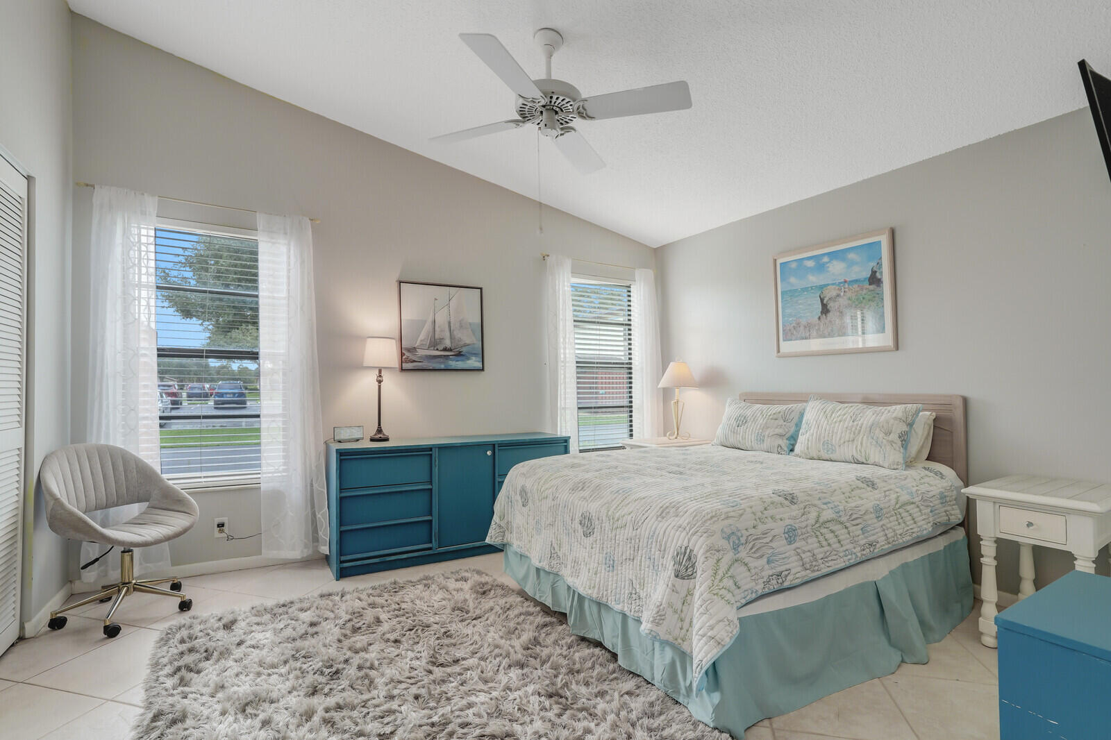 8020 Southeast Villa Circle Hobe Sound, FL 33455 - Photo 15 of 19 a bedroom with a bed and a dresser
